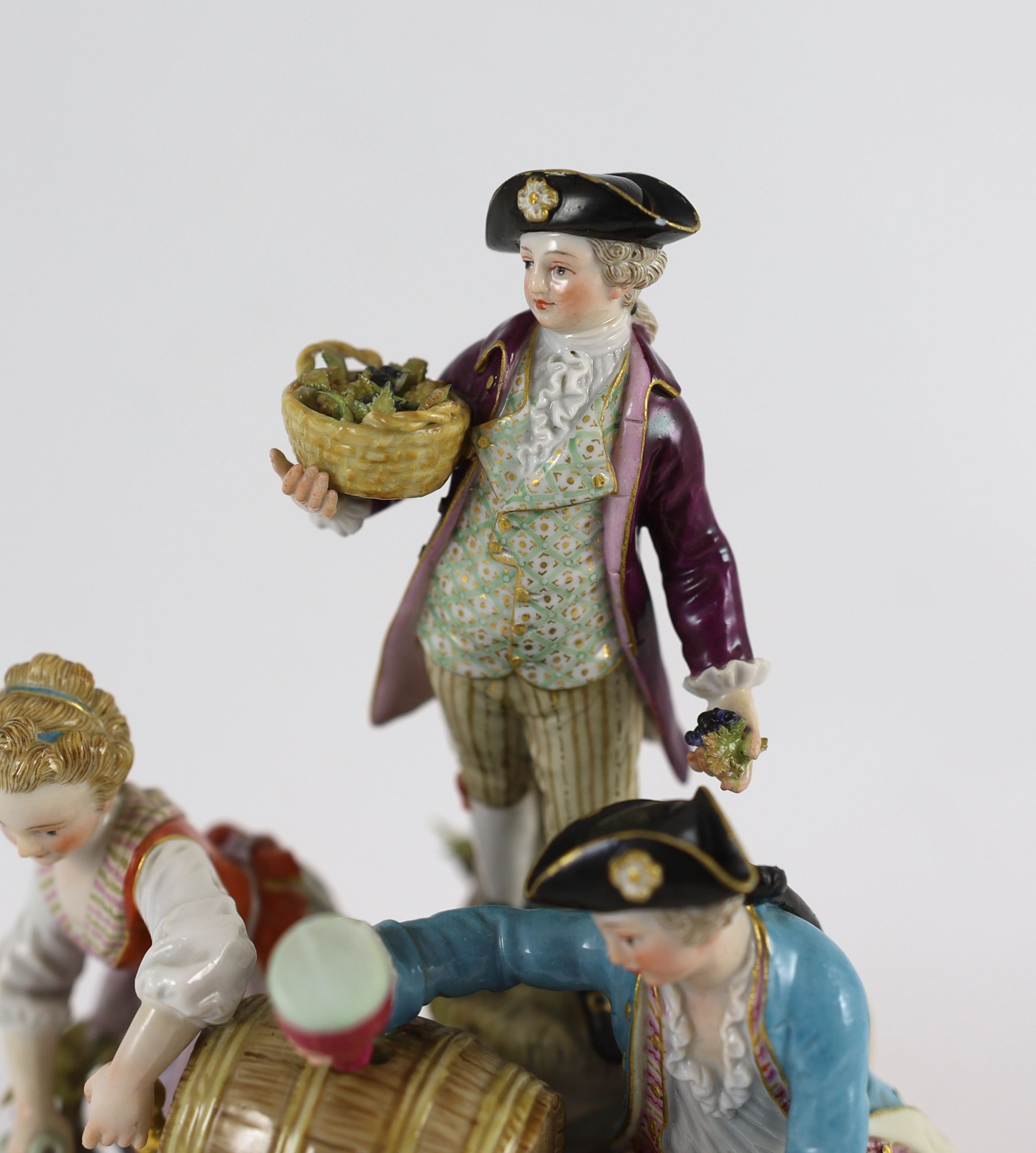 A Meissen group of the three winemakers, 19th century, after a model by Michel Victor Acier, 21 cm high